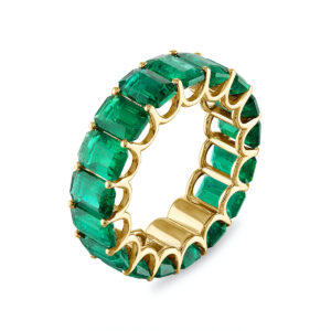 Eternity band in 18K yellow gold with emerald-cut Emeralds (9.23 ctw.), $26,350; Shivam Imports