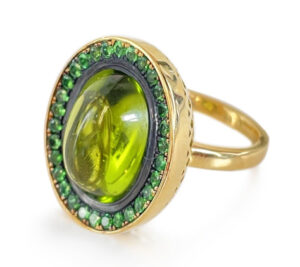 Ring in 18K yellow gold with an 11.95 ct. Peridot and Tsavorites (1.63 ctw.), $8,965; Ray Griffiths